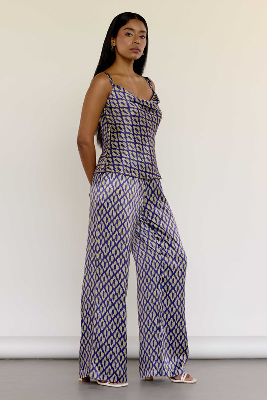 The Uma Pant features a vintage-inspired ikat print, drawn from a 1970s Indonesian handwoven ikat cotton scarf. With an adjustable waistband and a relaxed straight leg, these machine-washable pants pair effortlessly with the Uma Top or your favorite white top.