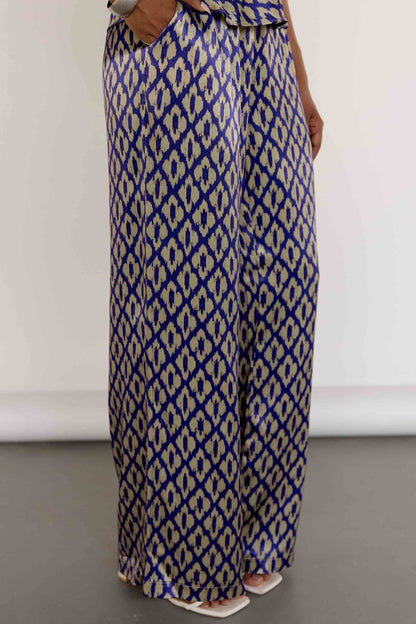 The Uma Pant features a vintage-inspired ikat print, drawn from a 1970s Indonesian handwoven ikat cotton scarf. With an adjustable waistband and a relaxed straight leg, these machine-washable pants pair effortlessly with the Uma Top or your favorite white top.