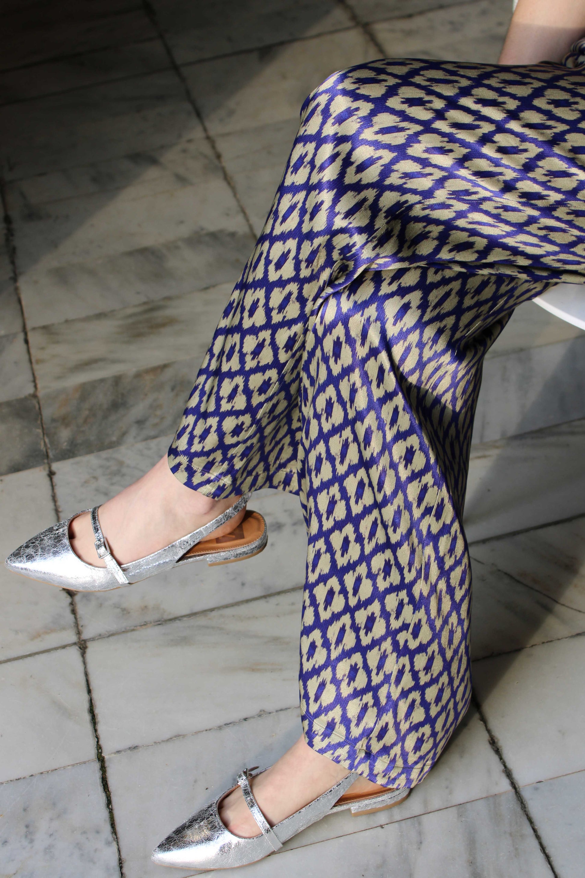 The Uma Pant features a vintage-inspired ikat print, drawn from a 1970s Indonesian handwoven ikat cotton scarf. With an adjustable waistband and a relaxed straight leg, these machine-washable pants pair effortlessly with the Uma Top or your favorite white top.