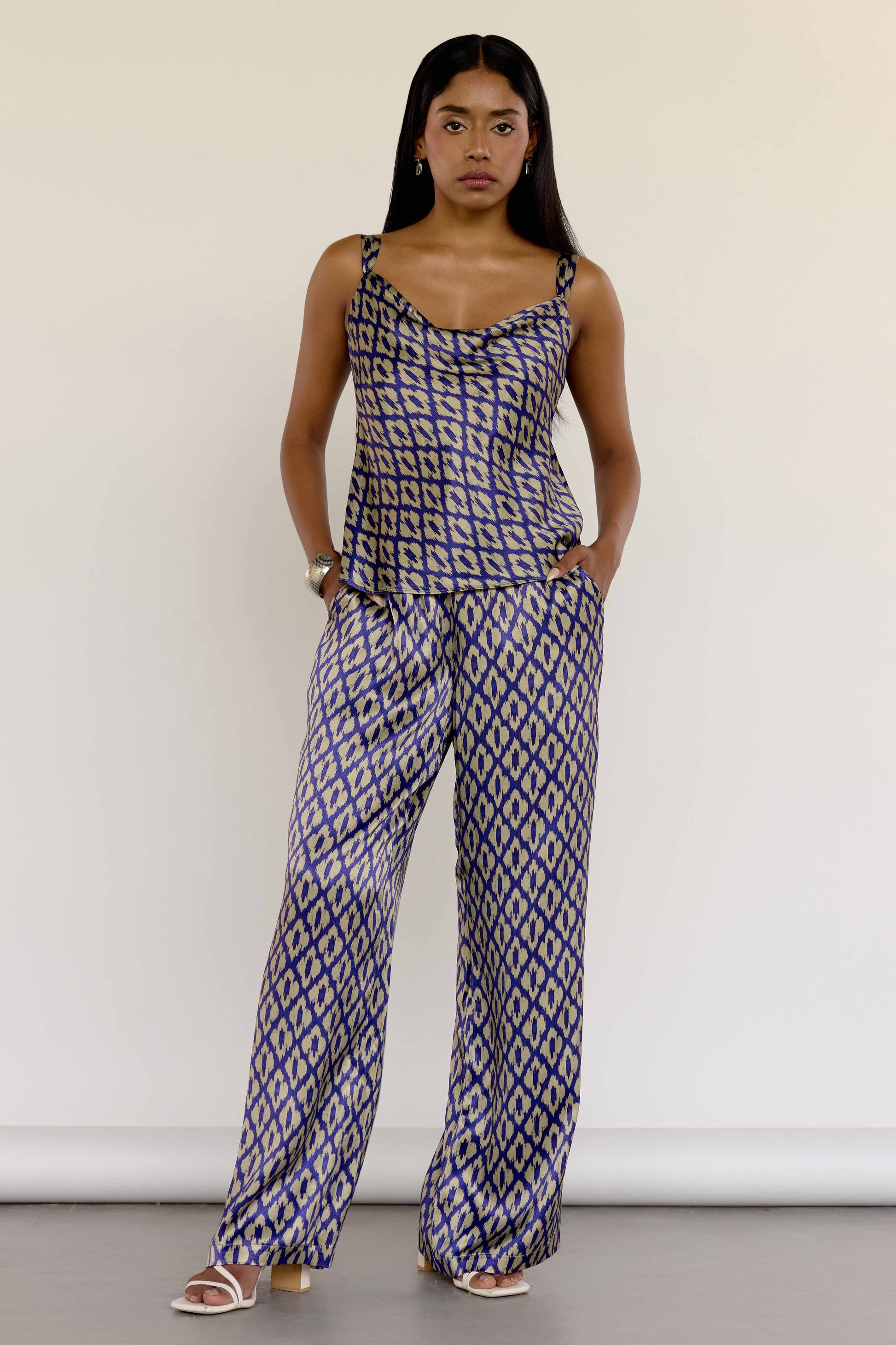 The Uma Top features a vintage-inspired ikat print, drawn from a 1970s Indonesian handwoven ikat cotton scarf. With adjustable tie straps for a custom fit and made from machine-washable fabric, it seamlessly transitions from day to night. Wear as a separate piece or pair with the Uma Pant.