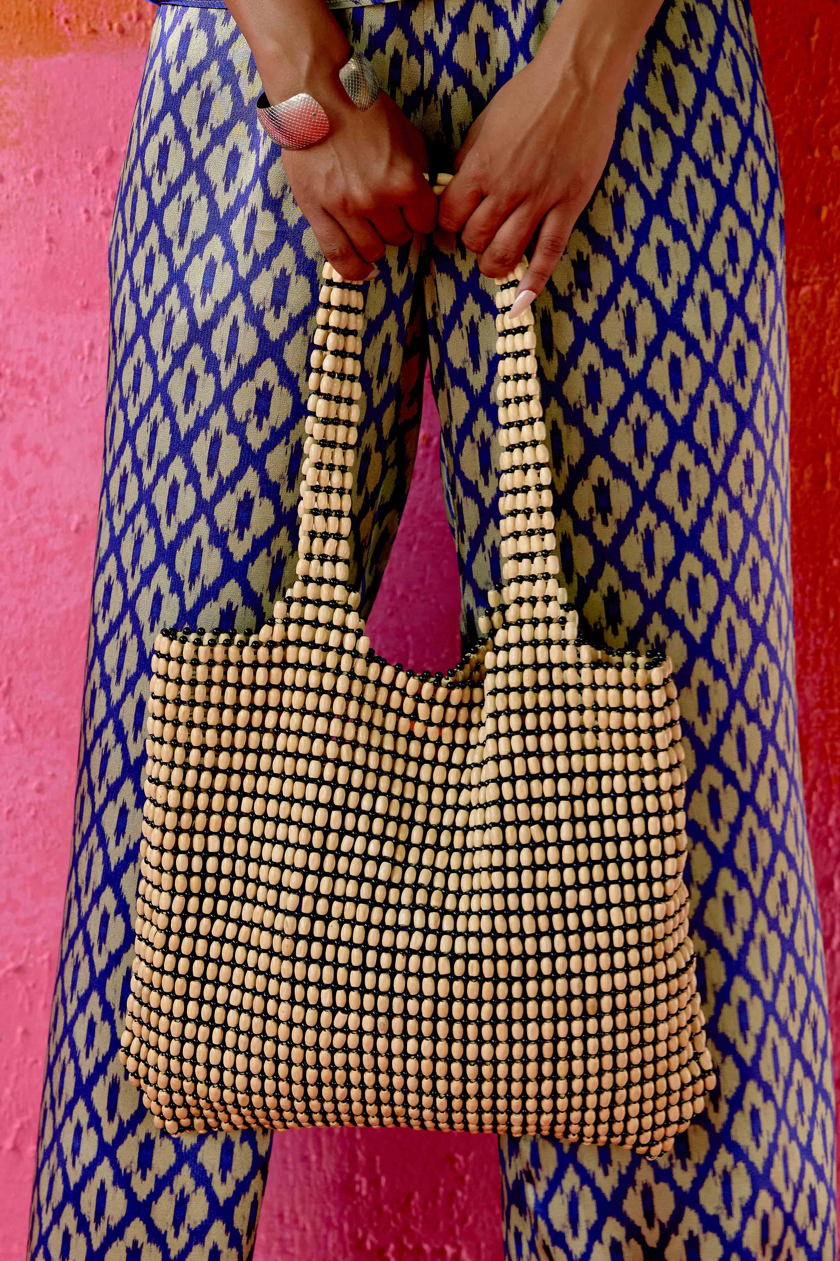 The bag you’ll reach for all summer long. Hand-assembled with smooth wooden beads, the Tula Tote is roomy, durable, and effortlessly chic. Its wide silhouette fits all your essentials (and then some), while the intricate beads add just the right touch of texture.

Whether you’re heading to the market, the beach, or brunch it’s functional, flattering, and made with love.&nbsp;