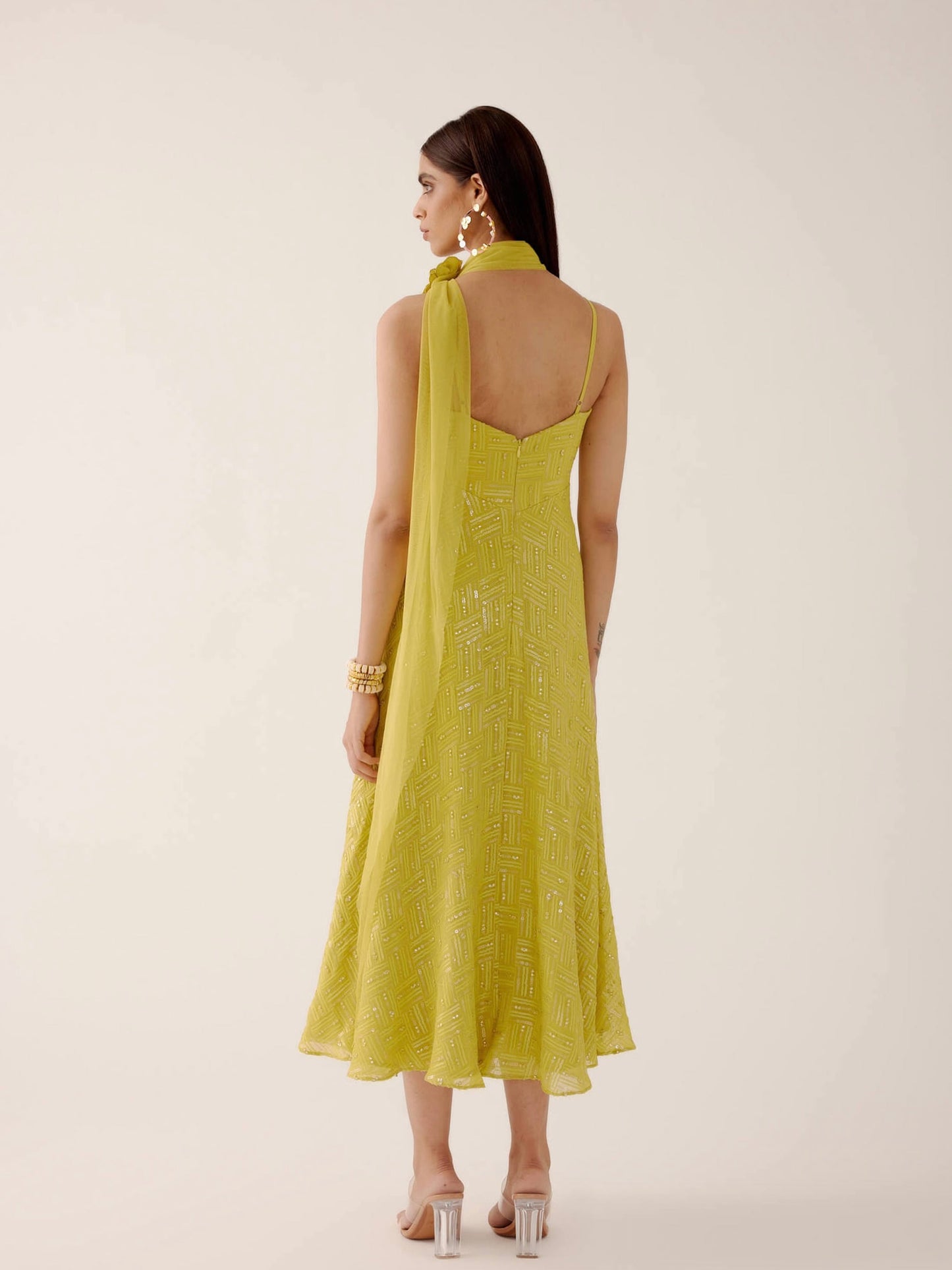 The Zara Dress is a midi-length dress with delicate sequin work throughout. The dress comes with a skinny dupatta and a detachable, handmade rosette clip.