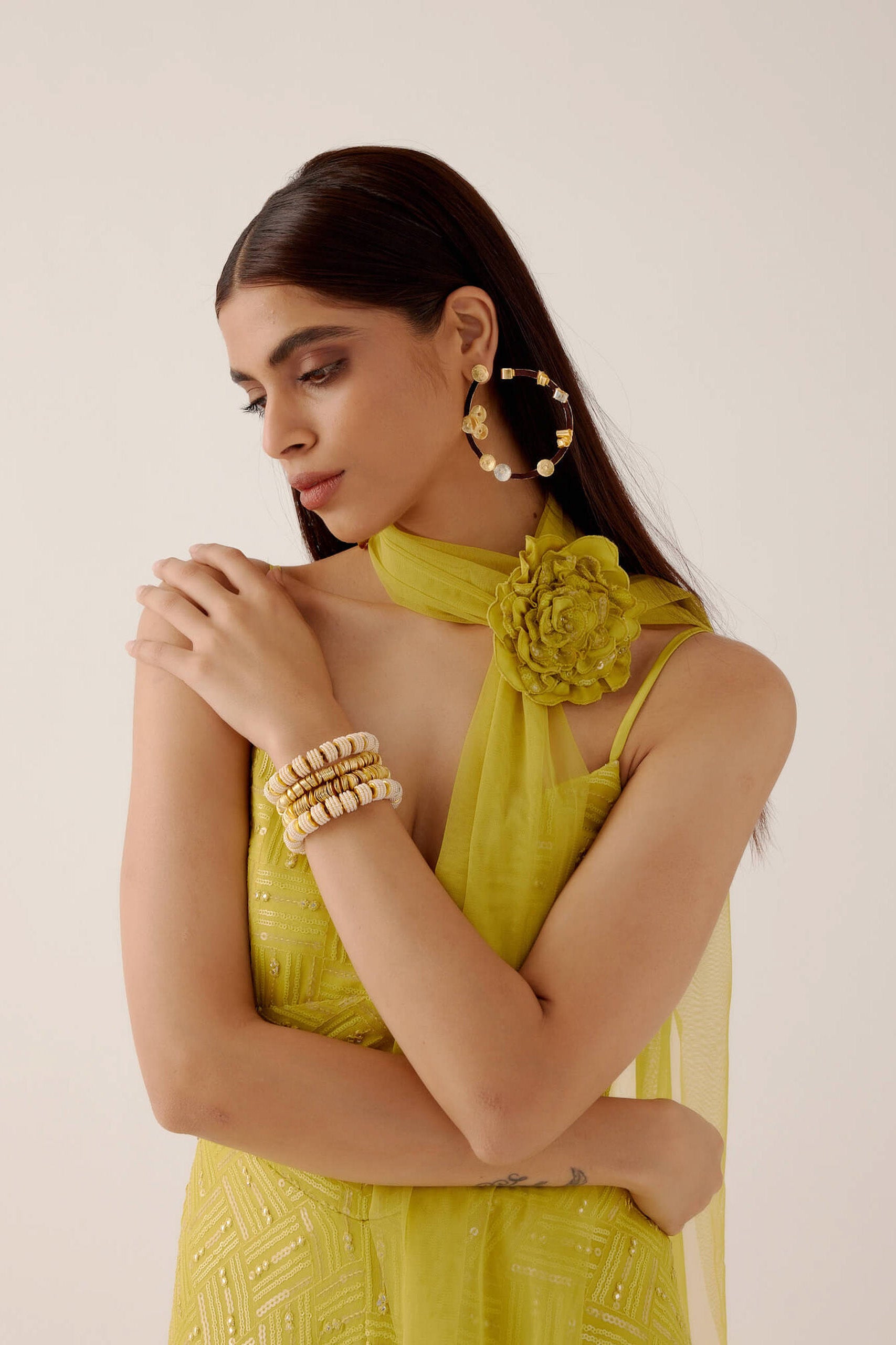 The Zara Dress is a midi-length dress with delicate sequin work throughout. The dress comes with a skinny dupatta and a detachable, handmade rosette clip. 