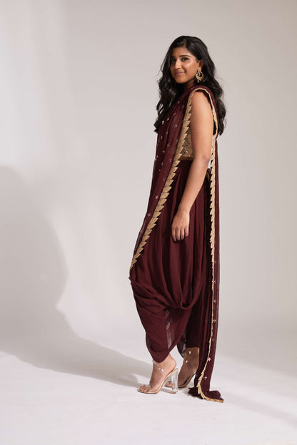 Dhoti pant outfit with attached drape and nude mirror work halter-style blouse