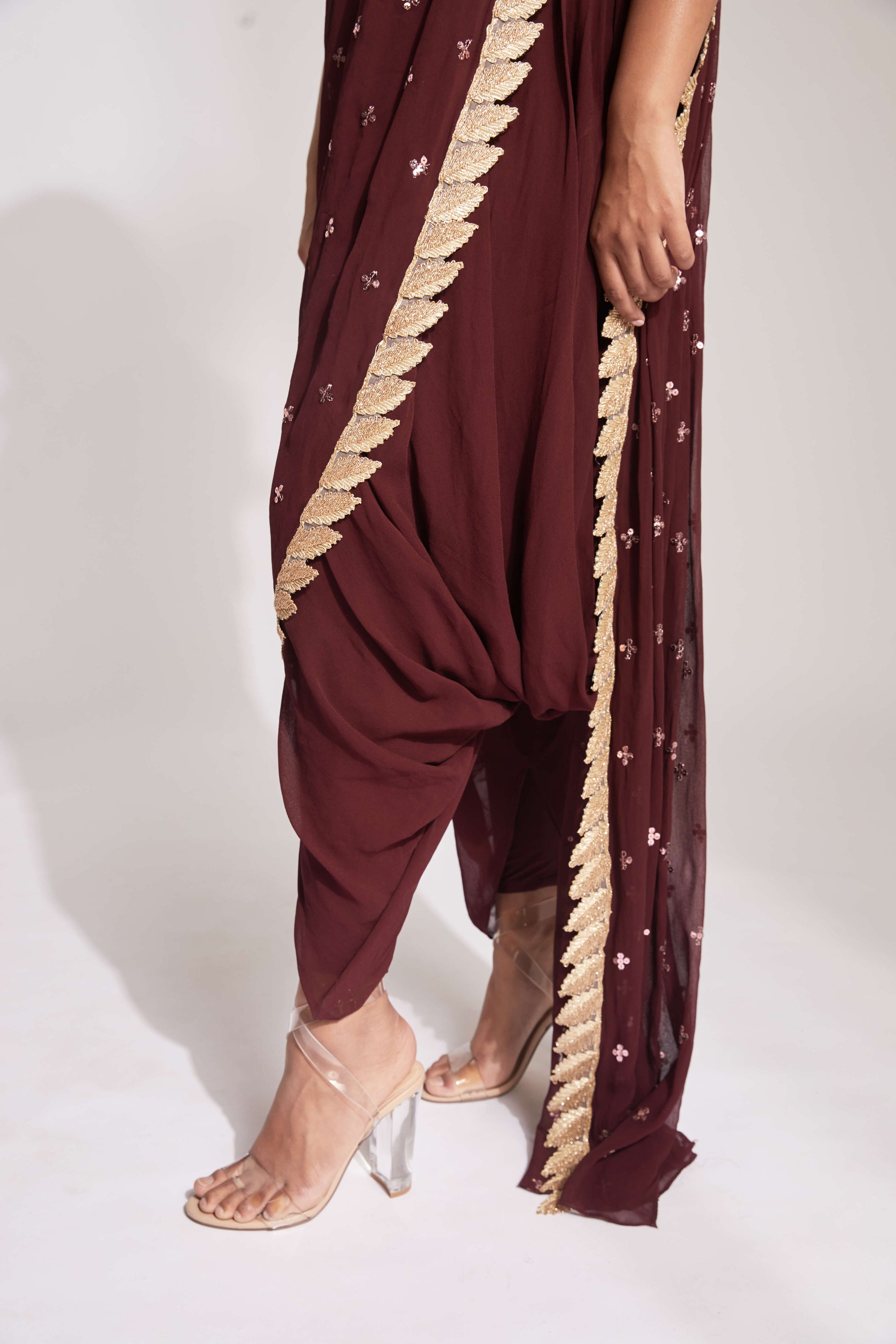 Dhoti pant outfit with attached drape and nude mirror work halter-style blouse