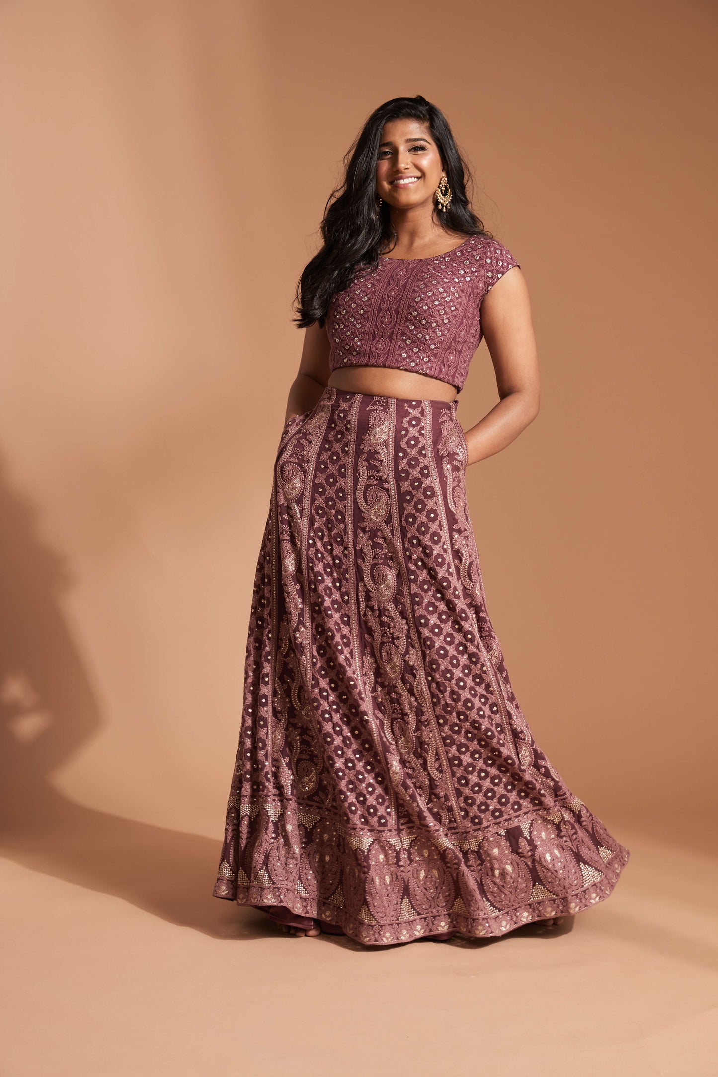 Burgundy lehenga made with lucknowi/chikankari work and featuring a cap sleeve blouse and cream scallop dupatta