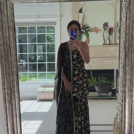 Woman in black and gold sequin outfit with Gharara pant, top, and dupatta