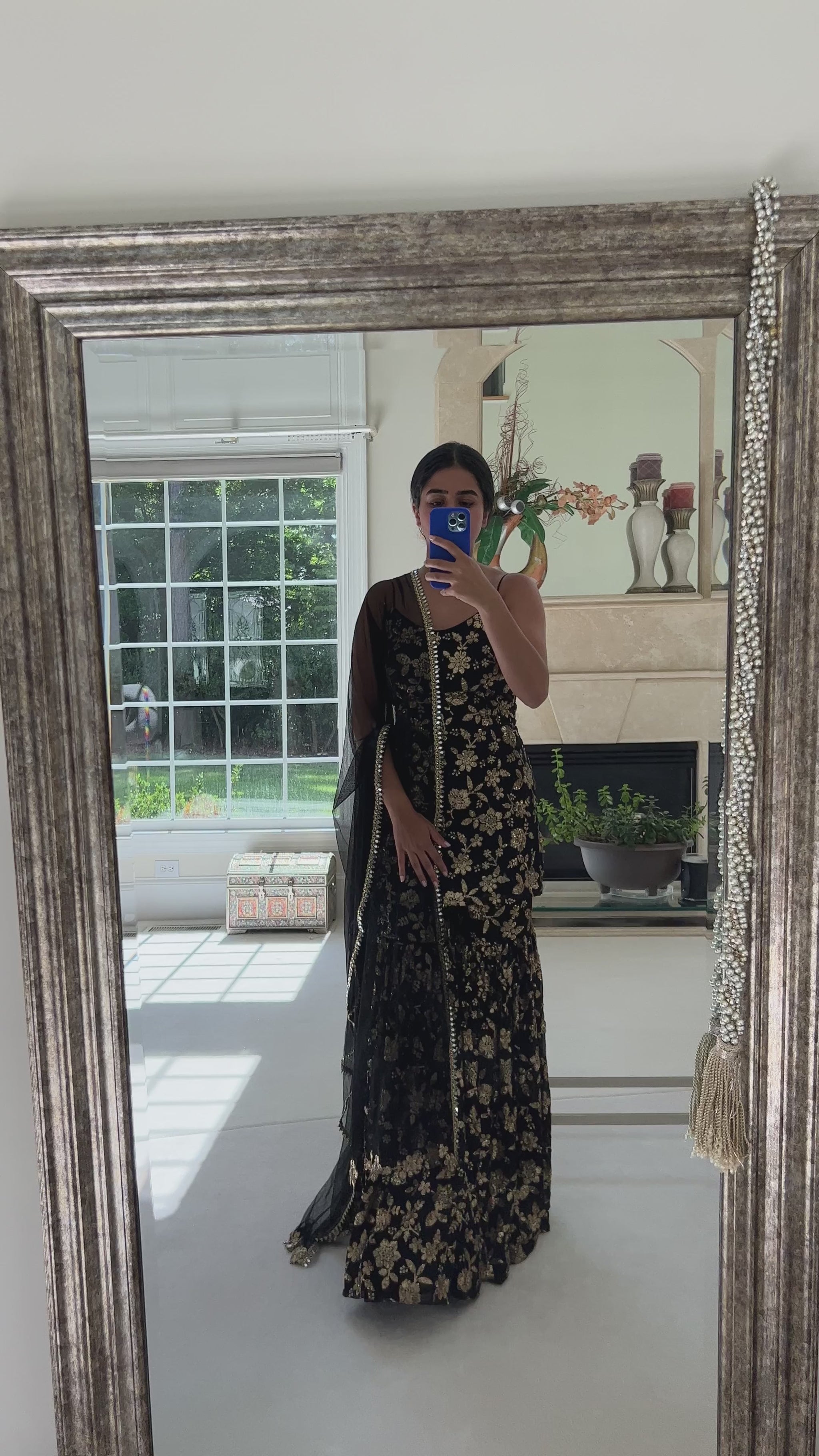 Woman in black and gold sequin outfit with Gharara pant, top, and dupatta