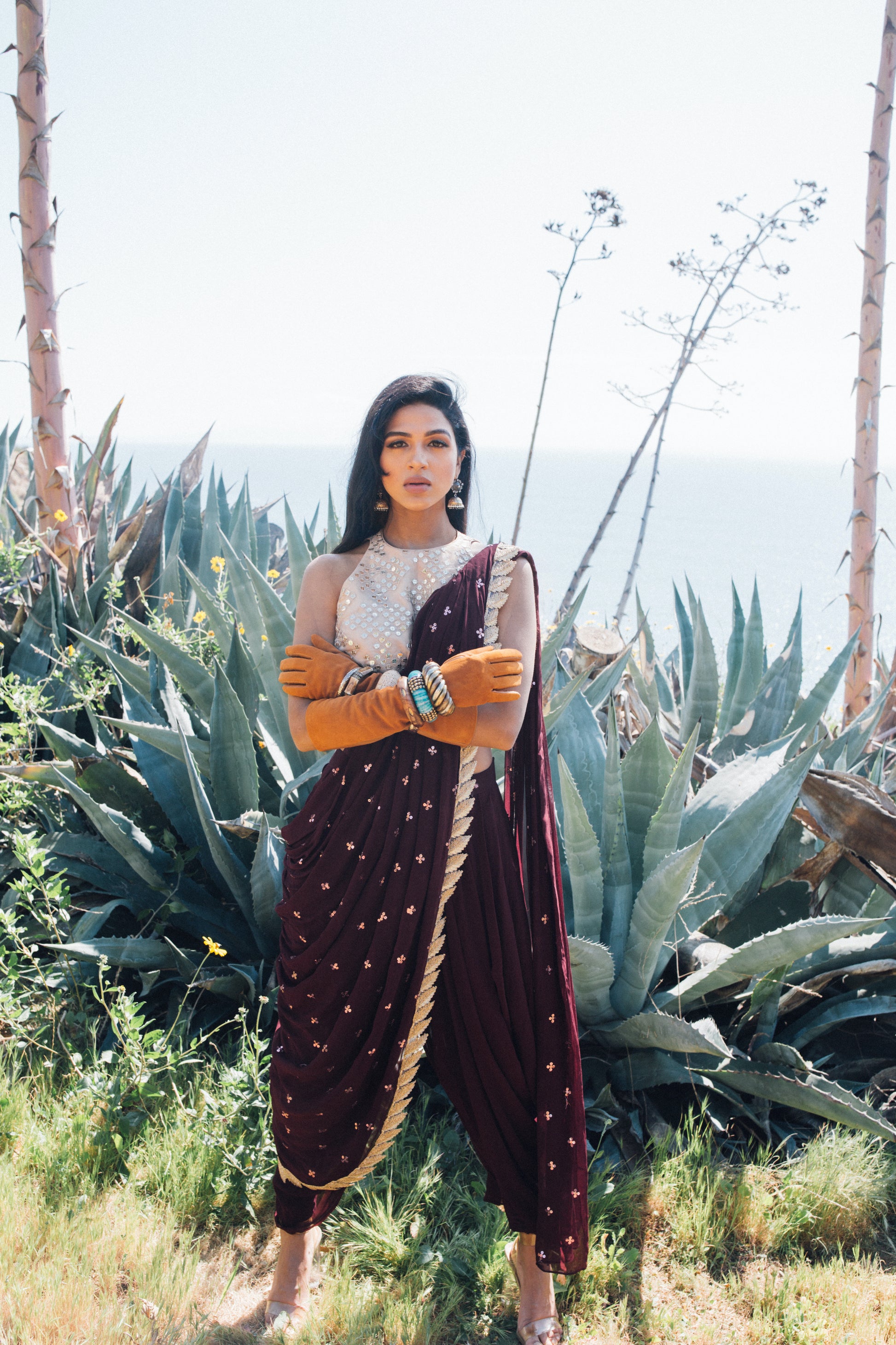 Dhoti pant outfit with attached drape and nude mirror work halter-style blouse