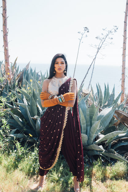 Dhoti pant outfit with attached drape and nude mirror work halter-style blouse