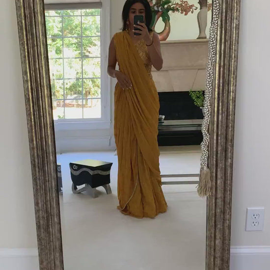 Video of woman wearing a palazzo set in mustard