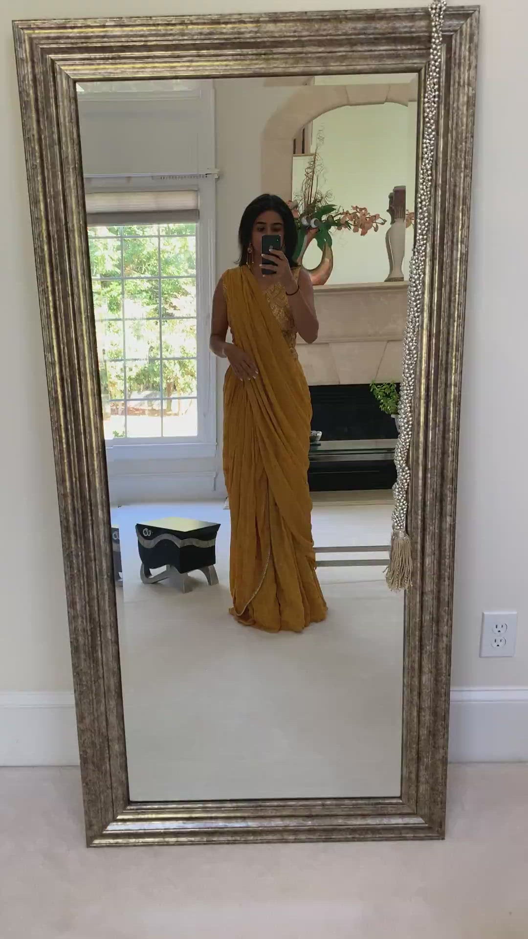Video of woman wearing a palazzo set in mustard